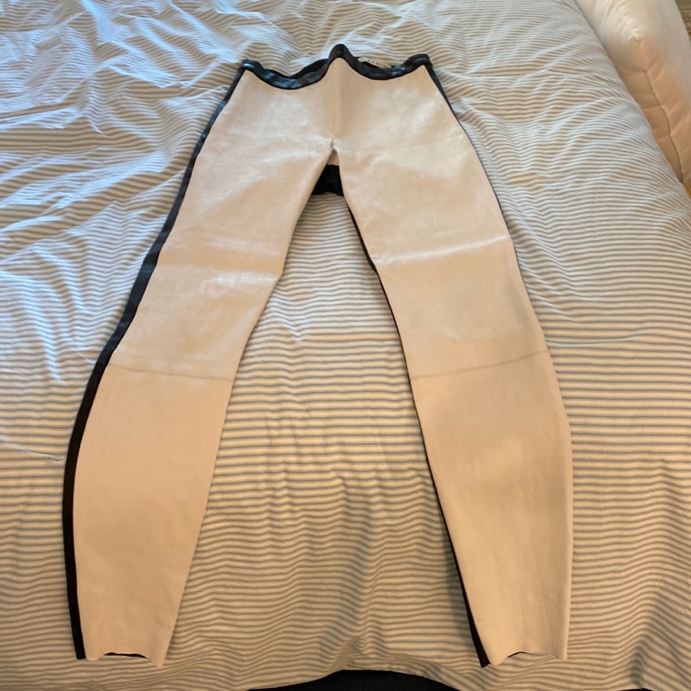 White and black leather pants